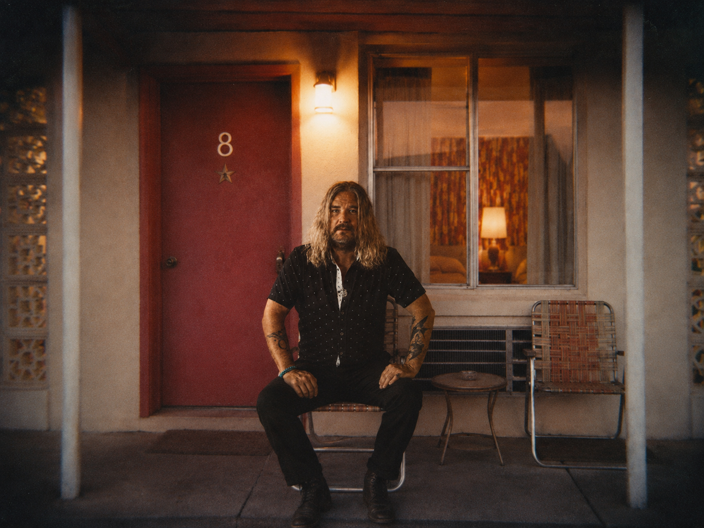 Israel Nash outside Room 8 at the Sweetheart Motel